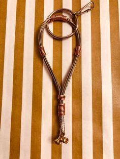 a brown and white striped table cloth with a pair of scissors on it