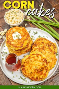 two corn cakes on a plate with dipping sauce and green beans in the background, text overlay reads corn cakes