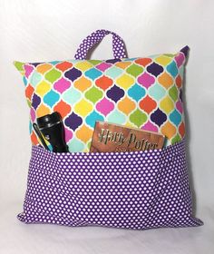 a colorful bag with a name tag on it