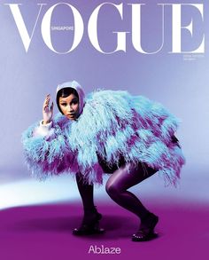 a magazine cover with an image of a woman in a fur coat and black leggings