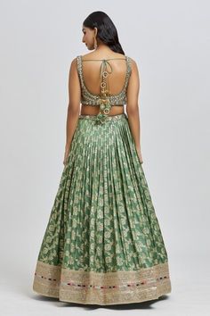 Mud green lehenga featuring an all-over floral pattern with golden embroidery. Paired with a padded blouse adorned with beads, mirror, zari, sequin, and cutdana work, along with a sequin embroidered dupatta., Fit: Relaxed Sleeveless Green Pallu Traditional Wear, Green Sleeveless Traditional Wear With Pallu, Green Sleeveless Traditional Wear For Wedding, Sleeveless Green Traditional Wear For Wedding, Sleeveless Green Traditional Wedding Wear, Sleeveless Green Sets For Reception, Green Sleeveless Sets For Reception, Cancan Lehenga, Cutdana Work