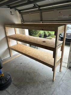 there is a shelf in the garage that has been built to hold items for repair