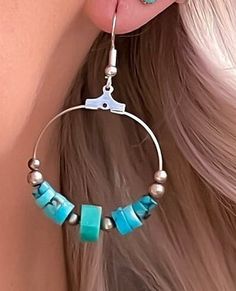 Turquoise hoop earrings in sterling silver. These turquoise bead earrings feature hand carved turquoise stone beads as well as sterling silver beads making these round drop earrings very special! These turquoise earrings have a boho feeling and also make a fine addition to your Western jewelry collection. This turquoise is top quality and makes a stunning compliment to your favorite outfit. Because these are natural turquoise stones, there is slight variations in each stone, which adds to the be Turquoise Dangle Jewelry, Turquoise Beaded Dangle Hoop Earrings, Unique Beaded Hoop Jewelry, Southwestern Dangle Hoop Earrings With Ear Wire, Turquoise Beaded Dangle Jewelry, Beaded Circle Jewelry For Gifts, Beaded Circular Jewelry Gift, Adjustable Turquoise Dangle Jewelry, Artisan Adjustable Drop Earrings Jewelry