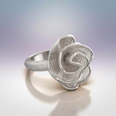 Elevate your jewelry collection with the exquisite beauty of our Rose Blossom Shaped Ring, meticulously crafted in Italy from your choice of 14k or 18k gold. This enchanting ring captures the delicate grace of a blooming rose, with its meticulously designed petals. The ring's distinctive allure lies in its juxtaposition of rough, textured surfaces that mimic the intricacies of nature, contrasted by polished edges that reflect light with a captivating brilliance. Experience the artistry of Italia Rose Blossom, Italian Jewelry, Blooming Rose, Gold Yellow, Verona, Ring Verlobung, Jewelry Collection, 18k Gold, Blossom