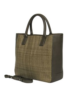 Elevate your accessory game with this woven leather tote from Shinola, featuring a unique use of leather and a practical hook swivel closure. Carry it by the handles or use the removable and adjustable straps for a hands-free experience - pair it with a flow maxi dress and espadrilles for a stylish day on the go. Handcrafted leather Made in the USA Woven leather front Hook swivel clasp top closure Two interior slide-in pockets on the sides One interior card slot Silver-toned hardware Width 13.5” Everyday Leather Woven Shoulder Bag, Everyday Leather Woven Bag, Woven Leather Bags For Everyday Use, Leather Straw Bag With Double Handle, Woven Leather Satchel For Daily Use, Chic Leather Rectangular Straw Bag, Leather Top Handle Straw Shopping Bag, Leather Straw Bag With Leather Handles For Shopping, Chic Leather Straw Bag With Leather Handles