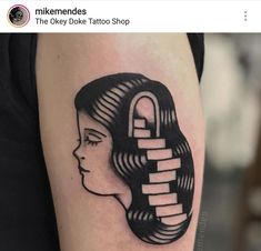 a woman's face with a lock in the middle of her head tattoo design