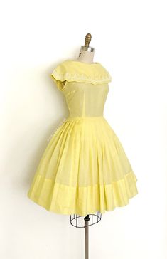 "vintage dress  Era: 1950's 1960's Label: none Material: cotton blend (semi sheer) and embroidered trim Closure: back metal zipper  Colour: lemon yellow, cream  Details: sailor like wide collar with a scalloped edge and trimmed with embroidery lace, timeless fit and flare silhouette, very full pleated skirt Fits like: medium  Bust: 38\" Waist: 28/29\" Hips: free Length: 38.5\" (6\" hem allowance) Condition: An as is, as found beauty. There is minor overall pilling to the fabric. A grouping of small spots on the skirt near the side. Some faint small spots near the waist seam. Priced accordingly. Washed and ready to wear.   shop policy  * All items are a final sale. No returns, exchanges and, order cancellations are not accepted.  * Ruby Mae Rose is not responsible for lost or stolen parcel( Yellow Coquette, 1950's Hairstyles, Ruby Mae, Vintage Summer Dress, Floral Dress Vintage, Fashion 1950, 1950’s Fashion, Scalloped Collar, Casual Work Dresses