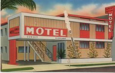 an old motel with stairs leading up to the top floor and palm trees in front of it