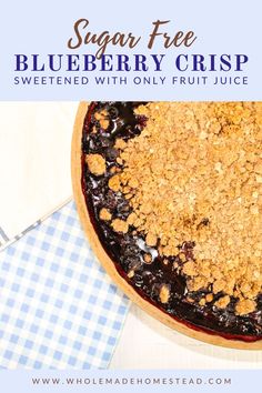 a blueberry crisp with only fruit juice in the middle is shown on a checkered table cloth