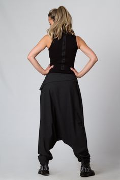 "Harem Pants Women, Black Pants, Drop Crotch Pants This is one of my favorite women's extravagant boho trousers - super comfy drop-crotch lose cut wide-leg tapered at the bottom maxi harem pants. I adore those loose, casual long pants! Handmade from 100% high-quality, excellent cool wool, these pants are an excellent winter, spring, and fall clothing option. KEY FEATURES: - Drop crotch, super loose - Tapered legs - Hidden zipper closure at the hip - Custom size and plus size available at NO EXTR Baggy Bohemian Bottoms For Fall, Bohemian Baggy Bottoms For Fall, Bohemian Black Pants, Bohemian Ankle-length Pants For Fall, Hippie Wide Leg Baggy Bottoms, Bohemian Trousers For Fall, Bohemian High Waist Black Bottoms, Bohemian Black High Waist Bottoms, Bohemian Fitted Ankle-length Bottoms