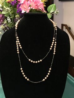 "This piece was designed to copy an actual necklace worn by Lady Mary in the PBS series Downton Abbey. This necklace is 50\" of glittering faceted gold natural iron pyrite beads interspersed with mint condition 6mm vintage cream faux Majorca pearls OR genuine AAA freshwater pearls (choose when you checkout). This is a VERY long necklace; it measures 50\" total from top to bottom. It can be worn as one long necklace (if you're tall or channeling your inner flapper) but it's also meant to be loope Elegant Handmade Chain Necklace With Round Beads, Elegant Pearl Necklaces With Faceted Beads, Handmade Elegant Long Chain Necklace, Elegant Handmade Long Chain Necklace, Elegant Silver Pearl Necklace With Faceted Beads, Long Pearl Necklace For Evening, Elegant Formal Necklace With Round Beads, Elegant Formal Chain Necklace With Round Beads, Elegant Faceted Necklaces