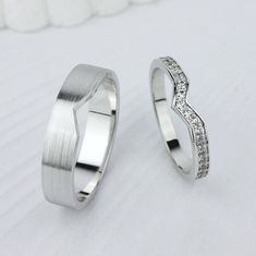 two white gold wedding bands with diamonds