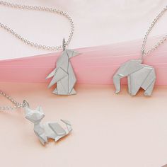 Origami Menagerie Necklaces | Origami jewelry, Origami necklace | UncommonGoods Origami Accessories, Artsy Accessories, Animal Necklaces, Uncommon Gifts, Origami Necklace, Jewelry Box Organizer, Horn Pendant Necklace, Origami Jewelry, Kay Jewelry