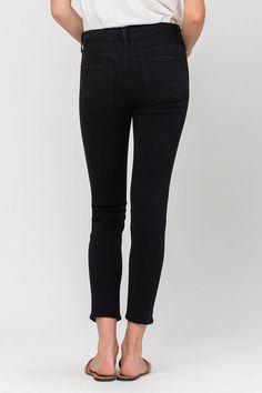 The "Mid Rise Ankle Skinny Jeans" are a must-have staple for any fashion-forward wardrobe. Their mid-rise cut strikes a balance between comfort and style, making them suitable for various occasions. These jeans provide a sleek and flattering silhouette, and their ankle length pairs perfectly with both casual sneakers and dressier heels, ensuring versatility in your everyday fashion choices.Front Rise: 9"Inseam: 27"Leg Opening: 10"Model is 5'10" wearing size 26 Style: Casual Print / Pattern: Soli Black Cropped Jeans With Frayed Hem For Fall, Black High-rise Cropped Jeans With Frayed Hem, Black High Rise Cropped Jeans With Frayed Hem, Chic Black Cropped Jeans For Spring, High Rise Black Cropped Jeans With Frayed Hem, Trendy Black Cropped Jeans With Frayed Hem, Trendy Stretch Cropped Jeans For Everyday, Black High Rise Cropped Jeans, Black Jeans With Frayed Hem For Everyday