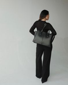 Sleek and structured, the Paloma is our bestseller for so many reasons. Perfect for work, the zipped middle compartment carries up to 16" laptops (measured diagonally), and two side compartments fit up to 13" laptops or important documents. Features a multitude of interior pockets to help you stay organized, comfortable 2cm wide straps that won't dig into your shoulder, and a shortened zipper track for easy access to your water bottle. This bag means business, so you can walk into every room with confidence. Handcrafted from the finest vegan ultrafiber, and lined in tan microsuede. Minimalist Tote Briefcase For Office, Modern Black Briefcase With Laptop Sleeve, Modern Black Briefcase With Zipper Pocket, Minimalist Tote Laptop Bag For Work, Black Laptop Bag With Luggage Sleeve For Office, Minimalist Black Laptop Bag With Laptop Sleeve, Minimalist Office Tote Briefcase, Minimalist Black Laptop Bag With Sleeve, Minimalist Laptop Tote Bag For Office