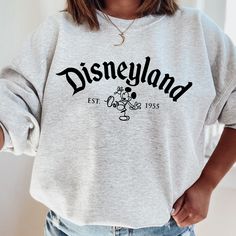 100% cotton heavy blend sweatshirt Classic Disneyland design with line art Mickey Unisex sizing for an oversized, relaxed fit Available in Ash Disneyland Sweatshirts, Disneyland Crewneck, Disneyland Sweatshirt, Disney Fits, Disneyland California, Screen Printing Designs, Disneyland, Crewneck Sweatshirt, Line Art