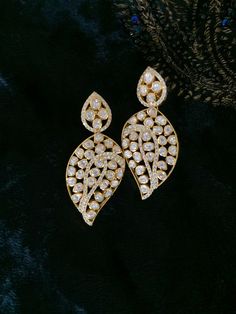 Material        : Silver Gemstone: Moissanite,  Stone colour:  Uncut Polki Primary colour: Gold Closure        : Screw back  Length: 5.5 cms  Width : 2.5 cms Intricate, hand crafted, Pure Silver Polki Earrings, studded with high quality Moissanite Polki ,made in 92.5 real silver with 22ct gold plating.  Product comes with 92.5 silver hallmark. All our pieces are in stock and will be dispatched with in 24 to 48 hours of order. Orders received  during the weekend will be dispatched on Monday Elegant American Diamond Earrings For Reception, Elegant Diamond Accented Earrings For Reception, Elegant Diamond-accented Earrings For Receptions, Elegant Diamond Earrings For Reception, Fine Jewelry Diamond Earrings For Reception, Luxury Bridal Earrings With Single Cut Diamonds, Luxury Bridal Earrings With Single Cut Diamonds For Wedding, Hallmarked Teardrop Diamond Earrings For Wedding, Diamond Earrings With Accents For Reception