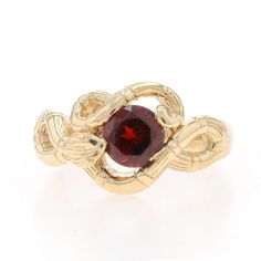 Size: 9 Sizing Fee: Up 2 sizes for $40 or Down 1 1/2 sizes for $30 Era: Vintage Metal Content: 14k Yellow Gold Stone Information Natural Garnet Carat(s): 1.60ct Cut: Round Color: Red Total Carats: 1.60ct Style: Solitaire Theme: Coiled Snake, Eternal Love Features: Etched Detailing Measurements Face Height (north to south): 17/32" (12.9mm) Rise Above Finger: 1/4" (5.8mm) Weight: 8.7 Grams Condition: Pre-Owned Condition Note: The garnet displays slight abrasions but they do not detract from the ring's overall vintage beauty or functionality. Professionally cleaned, polished, and tested to guarantee metal content. Coiled Snake, Rise Above, Gold Stone, Solitaire Rings, Vintage Beauty, Eternal Love, Solitaire Ring, Last Minute Gifts, Vintage Metal