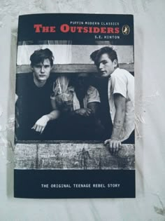 the outsides book sitting on top of a table