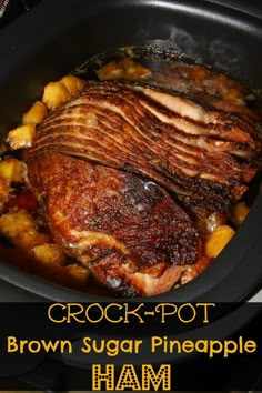 a close up of food in a crock pot with meat and potatoes on the side