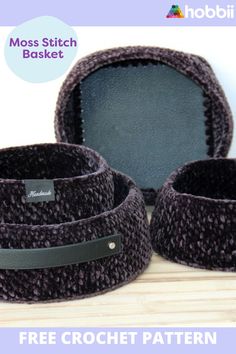 three crochet baskets sitting on top of a wooden table