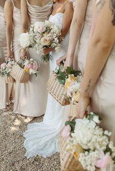 the bridesmaids are holding their bouquets together