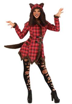 a woman in a red and black plaid dress is dressed up as a cat with her hands out