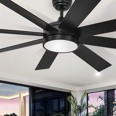 a black ceiling fan in a living room