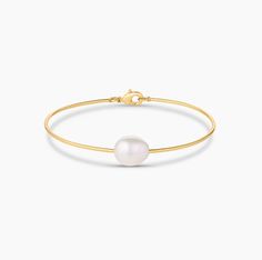 14k gold plated freshwater pearl bangle bracelet with lobster clasp closure. Gold Plated Bracelets With Gold Clasp, Adjustable Bangle Bracelet With Pearl Drop, Classic Bangle With Gold Clasp, Elegant Pearl Charm Bangle Jewelry, Classic Bangle Jewelry With Gold Clasp, Formal Pearl Chain Bangle Bracelet, Classic Pearl Charm Bangle Bracelet, Adjustable Gold Plated Pearl Bangle, Akoya Pearl Drop Round Bracelets