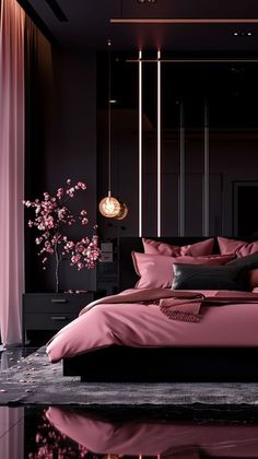 a large bed with pink sheets and pillows in a dark room next to a window