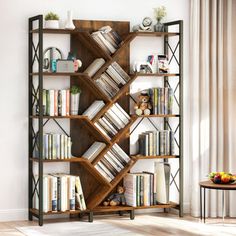 a bookshelf filled with lots of books on top of a hard wood floor