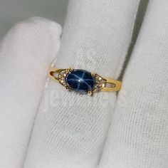 BAND- AS JEWELLERS GEMSTONE- 100% NATURAL STAR BLUE SAPPHIRE SAPPHIRE STONE SIZE -5X7MM SAPPHIRE WEIGHT - 1.90CT STONE SHAPE- OVAL GEM COLOUR - BLUE SECONDARY STONE - Natural DIAMOND PLEASE GIVE YOUR OPENION OR FEEDBACK ABOUT THE PRODUCT. WE ACCEPT BULK ORDER ALSO. THANK YOU Starburst Sapphire Ring, Star Saphire Ring, Gold Sapphire Ring Star, Dainty Sapphire Ring, Star-shaped Sapphire Rings For Anniversary, Star Shaped Sapphire Jewelry For Anniversary, Blue Sapphire Aesthetic, Yearning Aesthetic, Lesbian Rings