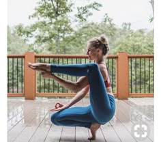 a woman is doing yoga on the deck