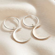 These lunar-inspired Crescent Moon Charm Hoop Earrings add a touch of celestial beauty suitable for both everyday and occasional wear. The crescent shapes evoke mystical and romantic associations often linked with the moon, such as cycles, intuition, and feminine energy. Handmade by our jewellers in Sterling Silver. We make our jewellery using the finest quality 925 Sterling Silver. Small Hoop Jewelry With Moon Charm For Everyday Wear, Celestial Crescent Earrings For Everyday, Celestial Style Hoop Earrings For Everyday Wear, Everyday Crescent Hoop Earrings Nickel Free, Silver Celestial Hoop Earrings For Everyday, Crescent Hoop Earrings Gift, Minimalist Crescent Hoop Earrings With Ear Wire, Everyday Crescent Hoop Earrings With Ear Wire, Minimalist Crescent Hoop Earrings For Everyday