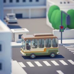 a small bus is driving down the street