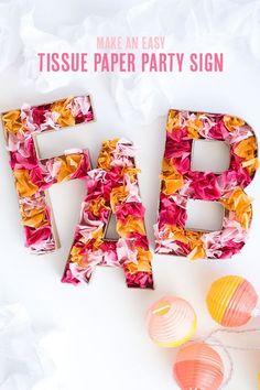 tissue paper party sign made out of colorful flowers and the words pag written in large letters