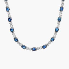 Vibrant sapphires and brilliant diamonds shine in this stunning necklace. Blavk Star Daphire Necklaces, Oval Sapphire Diamond Necklace, Luxury Sapphire Necklace With Diamond, Sapphire Necklace With Brilliant Round Cut, Luxury Sapphire Necklace With Brilliant Cut, Classic Sapphire Diamond Necklace With Brilliant Cut, Luxury Sapphire Gemstone Diamond Necklace, Classic Diamond Necklace With Sapphire, Sapphire Necklace With Diamond Accents And Round Cut