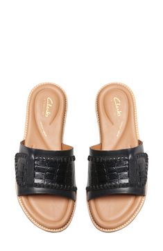 Decorative stitching and mixed textures distinguish a leather slide sandal set on a cushioned footbed for lasting comfort. Cushioned footbed Leather upper and lining/rubber sole Imported Burberry Slides, Casual Beach Sandals, Decorative Stitching, Leather Slide Sandals, Slides Sandals, Leather Slides, Brown Sandals, Tan Suede, Beach Sandals