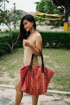 "The beautiful tote bag designed by oriental inspiration for lazy days at the beach and wandering around. It is made with an amazing piece of fabric woven by the HMONG hill tribes of Lanna Region (Northern Thailand). It features cotton lining, Leather Straps and a zipper closure. This bag will enhance your appearance. We buy materials from Hmong market and we design and sew by hand. Some of the bags we modify to improve the product. The Hmong tribes live in the North of Thailand and have origins Bohemian Hobo Bag For Beach Season Travel, Bohemian Shoulder Bag For Beach Travel, Bohemian Shoulder Bag For Beach Season Travel, Red Tote Hobo Bag For The Beach, Bohemian Rectangular Hobo Bag For Beach Season, Summer Embroidered Beach Bag For Travel, Hippie Summer Hobo Beach Bag, Summer Hippie Beach Hobo Bag, Embroidered Tote Shoulder Bag For Beach