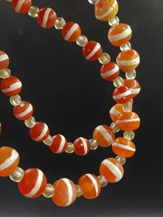 The Beautiful Antique Etched Carnelian Agate Beads Necklace With Rare Pattern Fast and Free Shipping world Wide Artisan Single Strand Orange Beaded Necklace, Unique Orange Gemstone Beads, Unique Hand-strung Orange Necklace, Orange Agate Oval Beads Jewelry, Orange Agate Oval Beaded Jewelry, Hand-strung Orange Jewelry With Round Beads, Unique Orange Agate Necklace, Orange Hand-strung Jewelry With Round Beads, Orange Natural Stones Beads