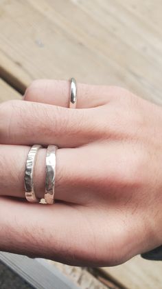 These rings are made to order and are hand fabricated. They come in 3 different styles, a plain texture, an rough hammered texture, and a grooved texture. They're made by casting sterling silver into delft clay, so sand particles and precipitate will appear in the final product. Makes each one unique ;) Delft Clay Casting, Unique Hammered Rings For Everyday Wear, Silver Hand Cast Rings For Everyday, Hand Cast Silver Rings For Everyday, Hand Cast Silver Rings For Everyday Wear, Artisan Handmade Silver Stackable Rings, Minimalist Hand Cast Jewelry For Anniversary, Unique Silver Stackable Rings With Hammered Detail, Unique Hammered Silver Stackable Rings