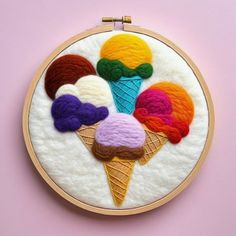 an embroidery project with ice cream cones and crochet work on the hoop frame