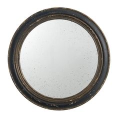 a black and gold circular mirror on a white background, with some speckles in it