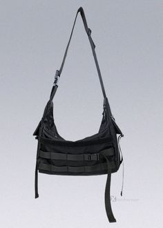 a black bag hanging from the side of a white wall with no one around it