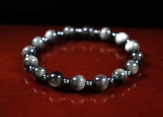 "Made with AAA Quality Natural 8mm Silver Obsidian and A Quality Natural 4mm Hematite. A great gift for men and women. Associated with the Base Chakra, and Scorpio and Sagittarius Zodiac signs.  (Style #Q068) ◭ SILVER OBSIDIAN is believed to bring advantages, patience, and perseverance. It improves intellect, communication, and the ability to \"see one's self\".  ◭ HEMATITE is the gemstone of \"Mental Durability\" and has the meaning of \"Courage.\" It's a very popular GOOD LUCK charm and is often used to increase skills in logical thinking and mathematics, and to increase confidence and will.                                     ⫷ FOR A MORE DETAILED DESCRIPTION OF THE BRACELETS,                                                     STONES OR OUR STORE, PLEASE VISIT US AT ⫸ Scorpio And Sagittarius, Silver Obsidian, Aries And Aquarius, Base Chakra, Zodiac Bracelet, Sagittarius Zodiac, Zodiac Signs Aquarius, Bracelet Mens, Scorpio Sagittarius