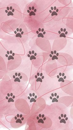 pink and black dog paw prints on watercolor paper