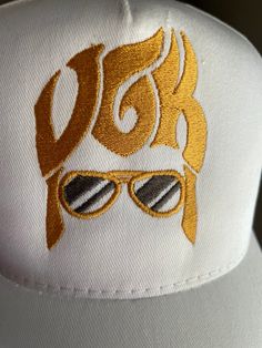 Quantities are limited so get them while available.  Vegas Golden Knights ELVIS hat/cap is finished in snapback style. Embroidered with commercial grade brilliant metallic threads Abailable in either Black, or White cap color. Please message me your color choice. Our unique embroidered designs are created with the utmost attention to details. They are NOT made in Mexico, or China they are proudly MADE IN AMERICA 🇺🇸 Adjustable Gold Baseball Cap For Summer, Casual Gold Snapback Hat, Casual Gold Cap, Gold Adjustable Cap, Adjustable Gold Cap, Gold Adjustable Trucker Hat For Summer, Adjustable Gold Trucker Hat For Summer, Gold Casual Baseball Cap, One Size, Gold Casual Baseball Cap, One Size Fits Most