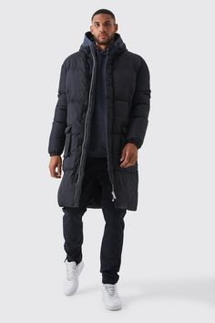 Keep out the chill while looking slick in a boohooMAN coat. Rev up your outerwear inventory this season with our unrivalled collection of coats and jackets for men. Whether you're looking for a heavy coat to combat the low temperatures, or a lightweight jacket to stand out while having fun at your favourite festival, we've got the trendiest designs to finish off your outfit with. Puffers, parkas and borg jackets are the perfect choices if you want to bundle up without sacrificing on style, and they look great when teamed up with chunky knitwear, denim and boots. Bombers and overcoats are beyond versatile and can turn any getup from laid-back to dapper in no time. Denim and Harrington jackets can't be missing in your trans-seasonal wardrobe, while cagoules and coach jackets will keep out th Long Puffer Jacket Outfit, Puffer Jacket Oversized, Puffer Jacket Outfit, Quilted Gilet, Plus Size Joggers, Coach Jackets, Long Puffer Jacket, Borg Jacket, Tall Hoodies