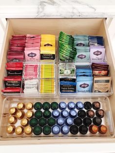 an open box filled with lots of different types of paint and other items in it