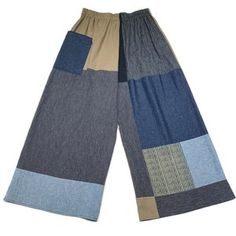 a pair of pants with blue and grey patches on them, both side by side